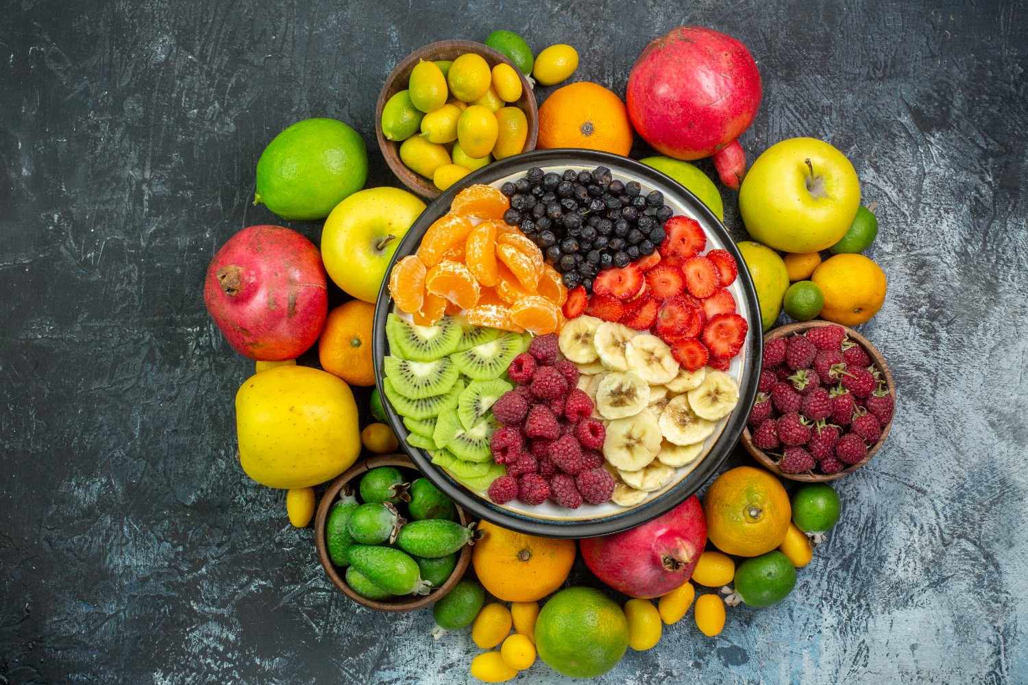 top-view-tasty-sliced-fruits-with-fresh-vegetables-gray-background